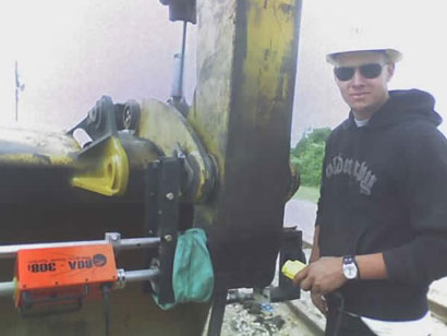 Picture shows horizontal welding in a hole using a cloth to shield the welding process